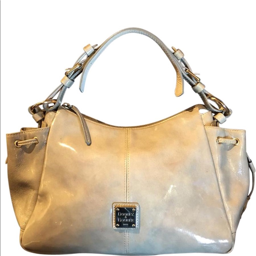 Dooney & Bourke cream patent leather handbag.